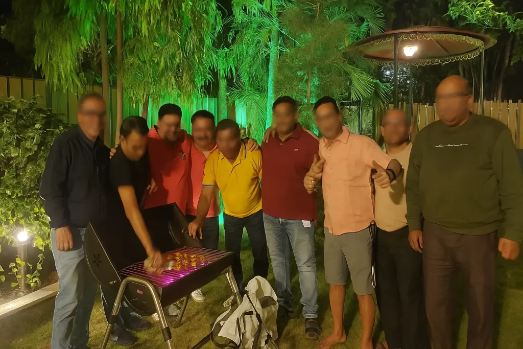Group of friends enjoying a barbecue evening at 5 BHK Villa Lonavala for groups