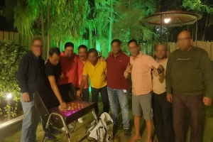 Group of friends enjoying a barbecue evening at blog page Misty Palace 5 BHK Villa in Lonavala