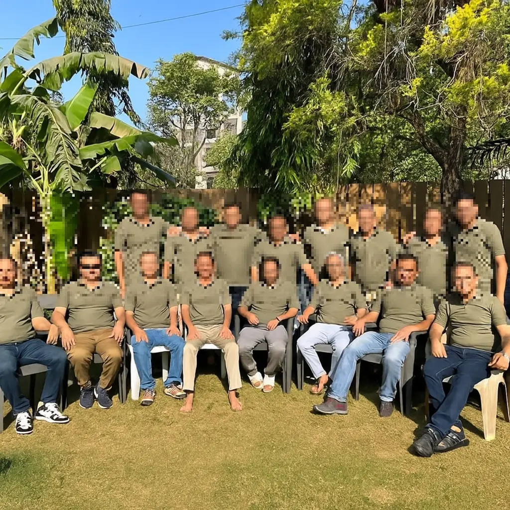 “Group of friends posing together during a sunny afternoon on the garden lawn at Misty Palace Villa, Lonavala