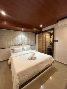 Luxurious Services Modern Amenities 10 Anvil Bedroom with wooden ceiling and attached bathroom - Misty Palace Villa, Lonavala