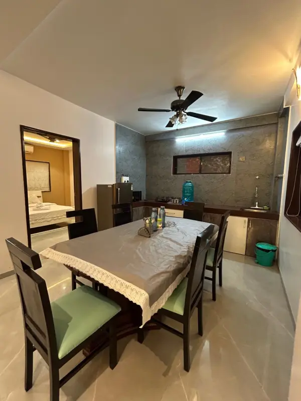 Spacious villa dining area with kitchenette and warm lighting - Misty Palace Villa, Lonavala