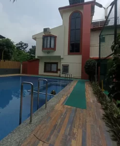 Lonavala villas poolside view with clear blue water and red tiles - Misty Palace 